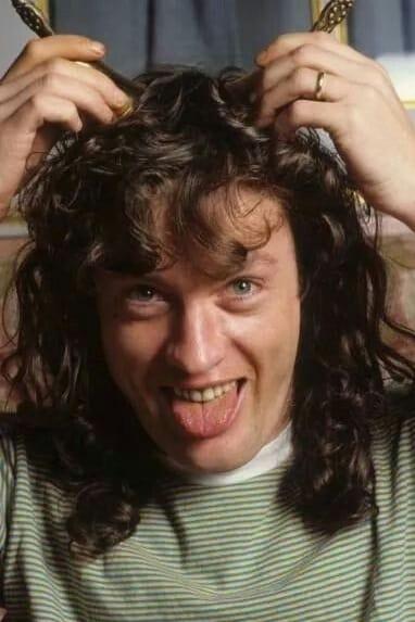 Angus Young | Angus Young - AC/DC Lead Guitar